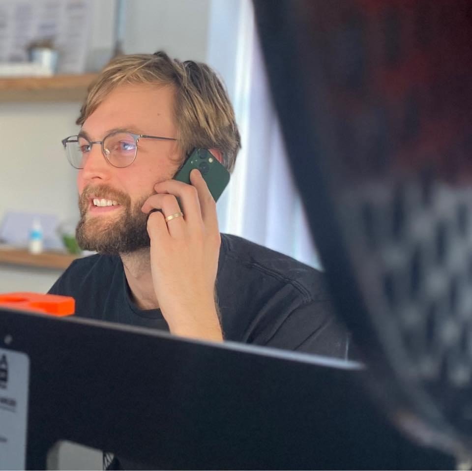 Alex on the phone in the background